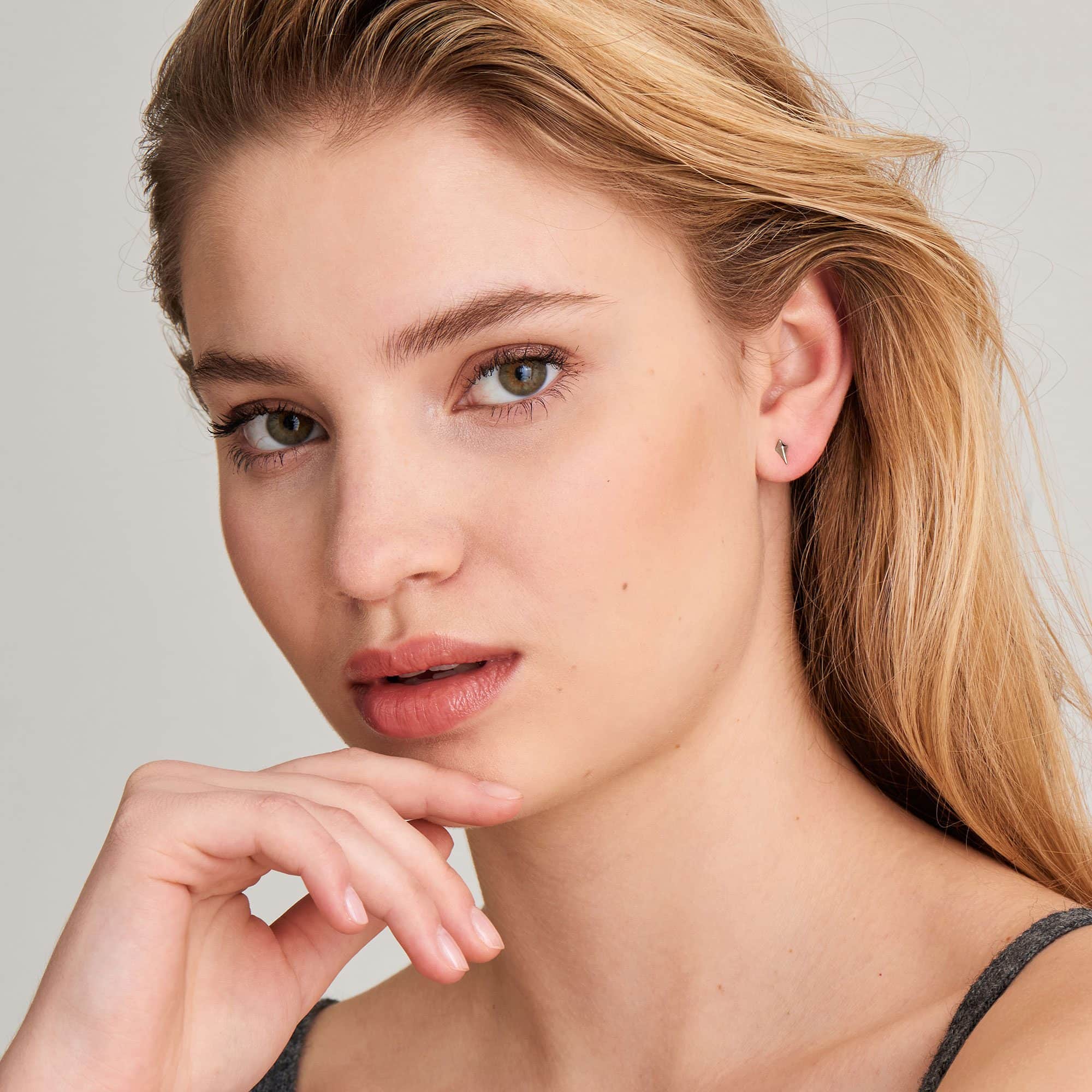 diamond shape stud earrings on model
