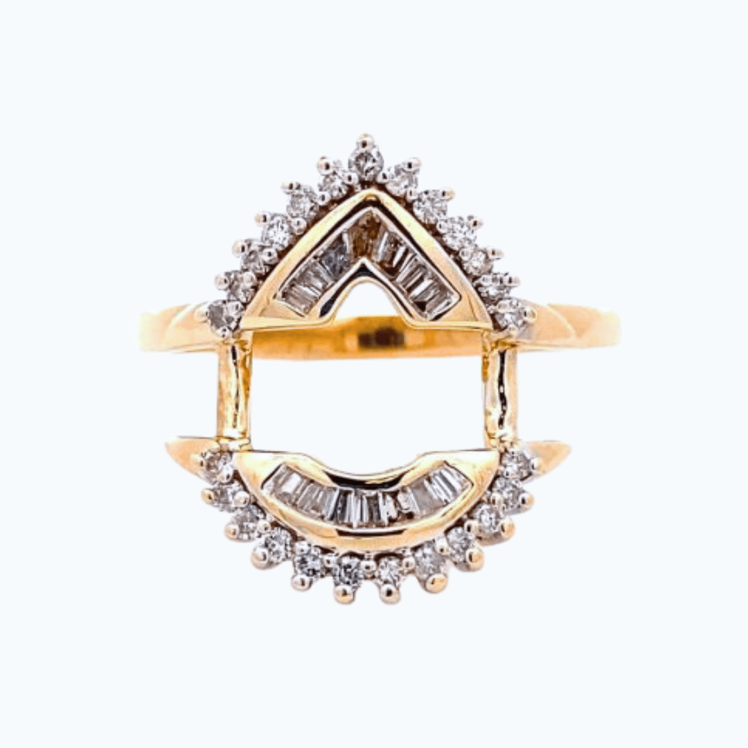 A yellow gold and diamond estate ring guard or ring enhancer designed for a primary ring with a pear-shaped center stone