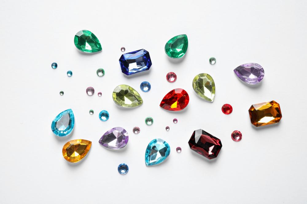 Different,Beautiful,Gemstones,On,White,Background,,Top,View